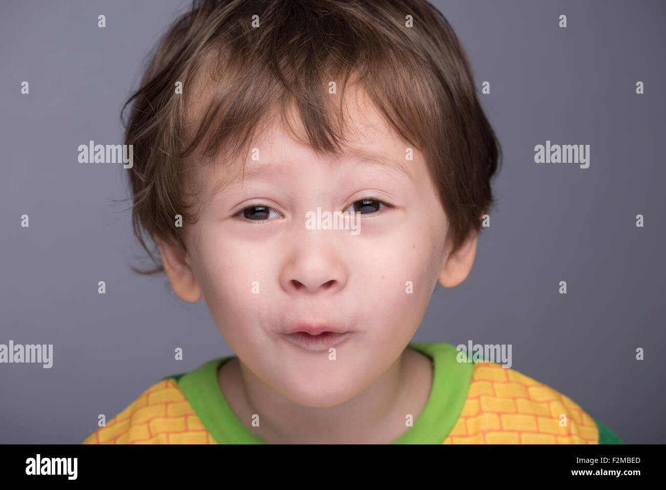 A happy 3 year old Japanese/Caucasian boy making a funny face. Stock Photo