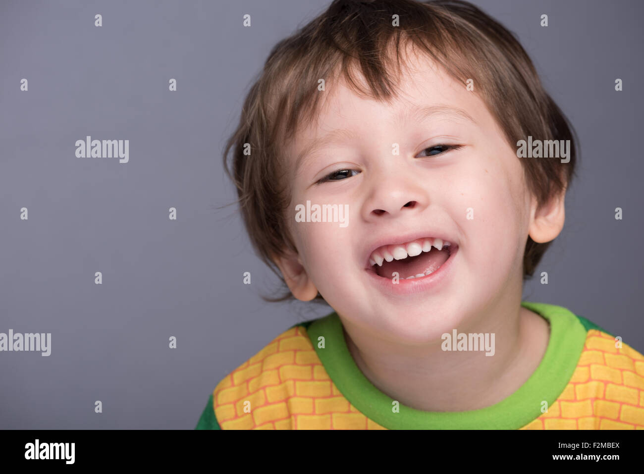 A happy 3 year old Japanese/Caucasian boy smiling. Stock Photo