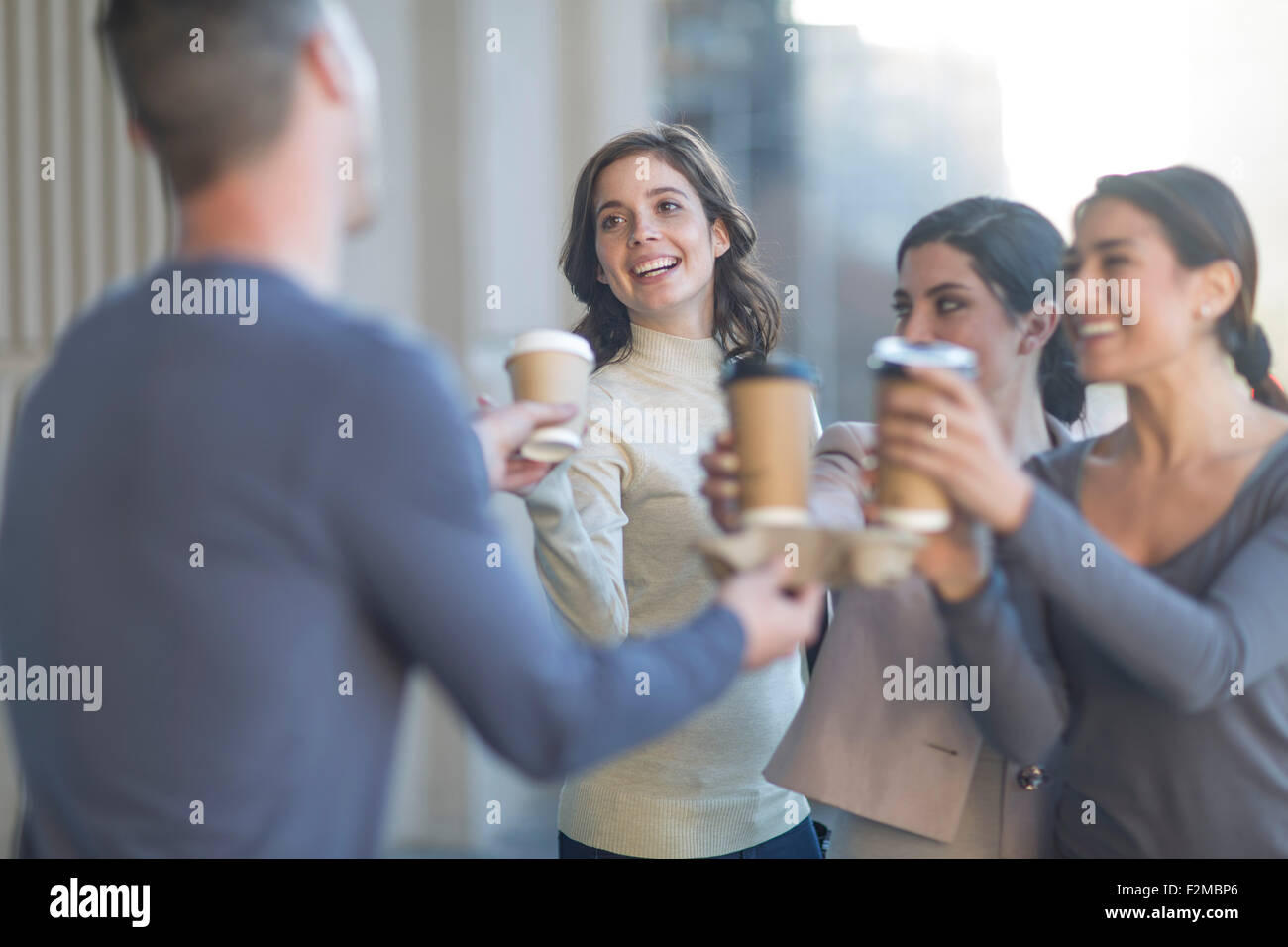 Colleagues having a coffee in the city Stock Photo Alamy