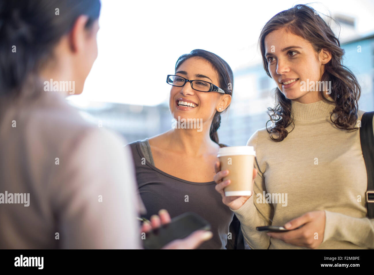 Colleagues having a coffee in the city Stock Photo Alamy