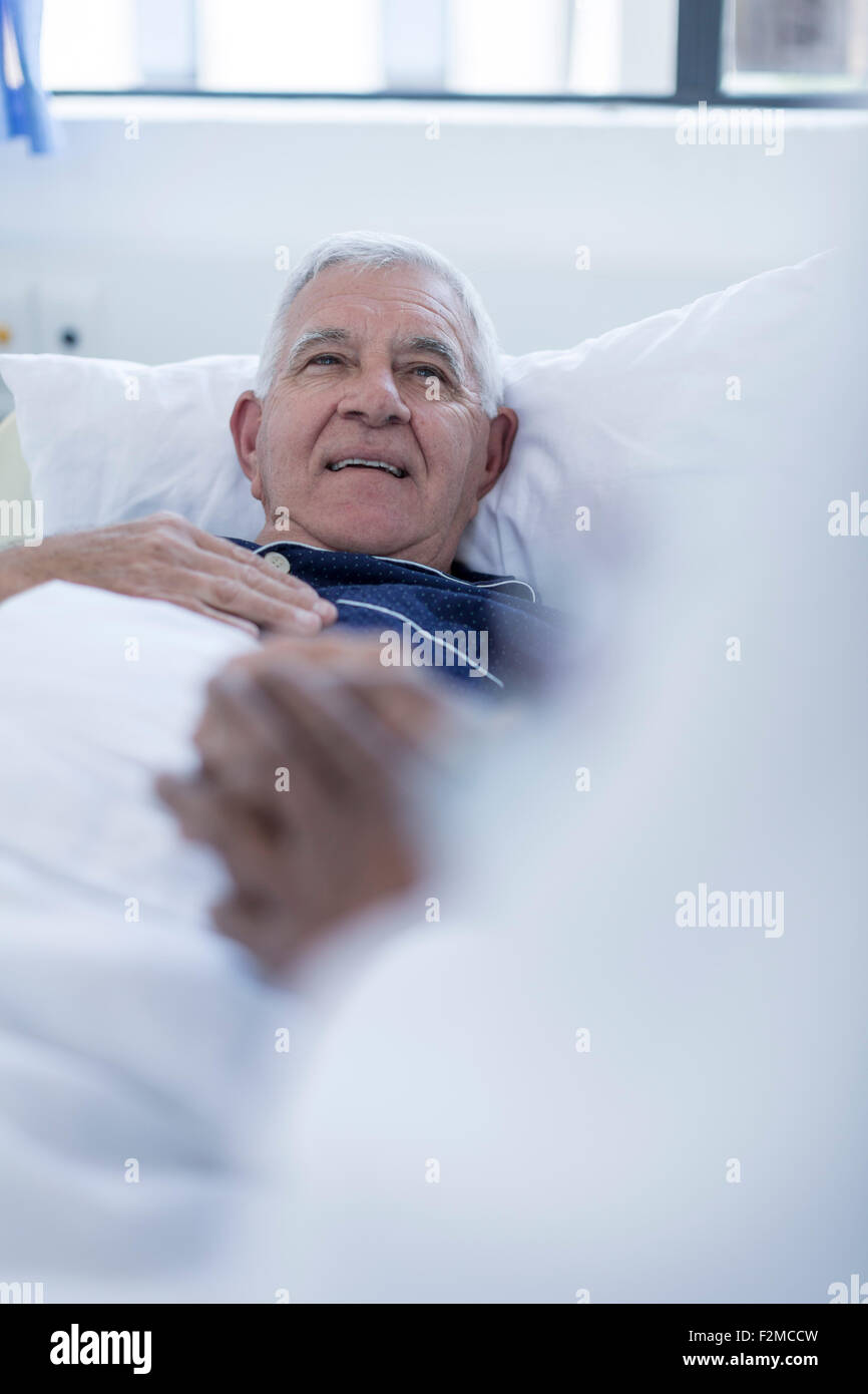 Doctor visiting hospital patient at bed Stock Photo Alamy
