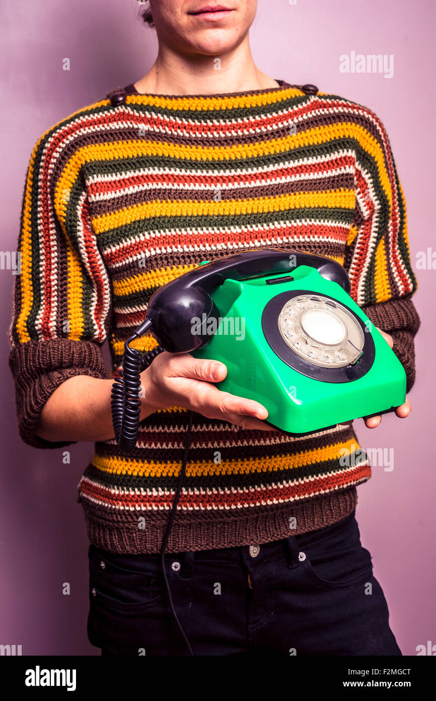 Young woman with retro telephone Stock Photo