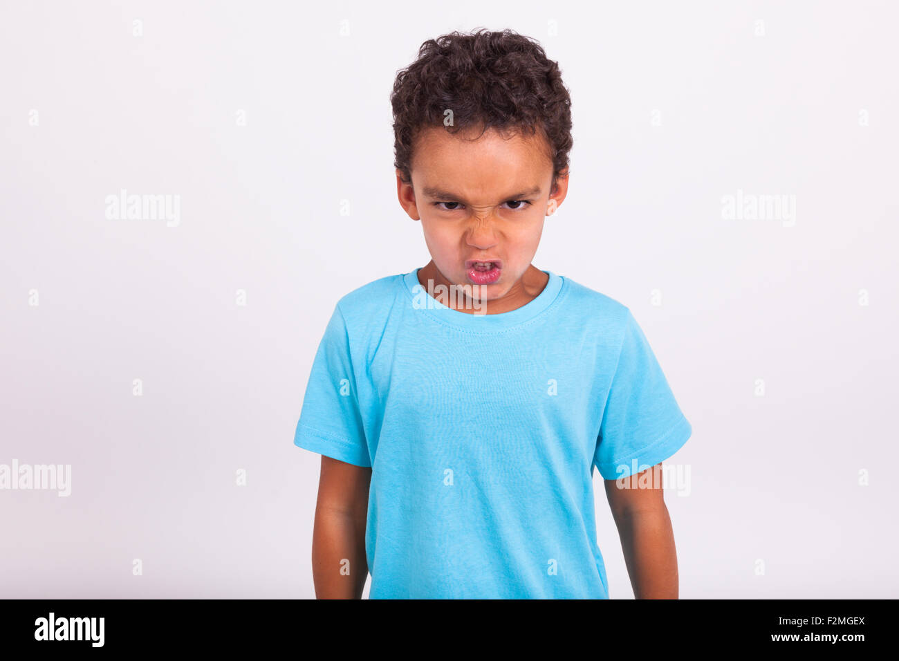 Portrait of a angry little African American boy Stock Photo