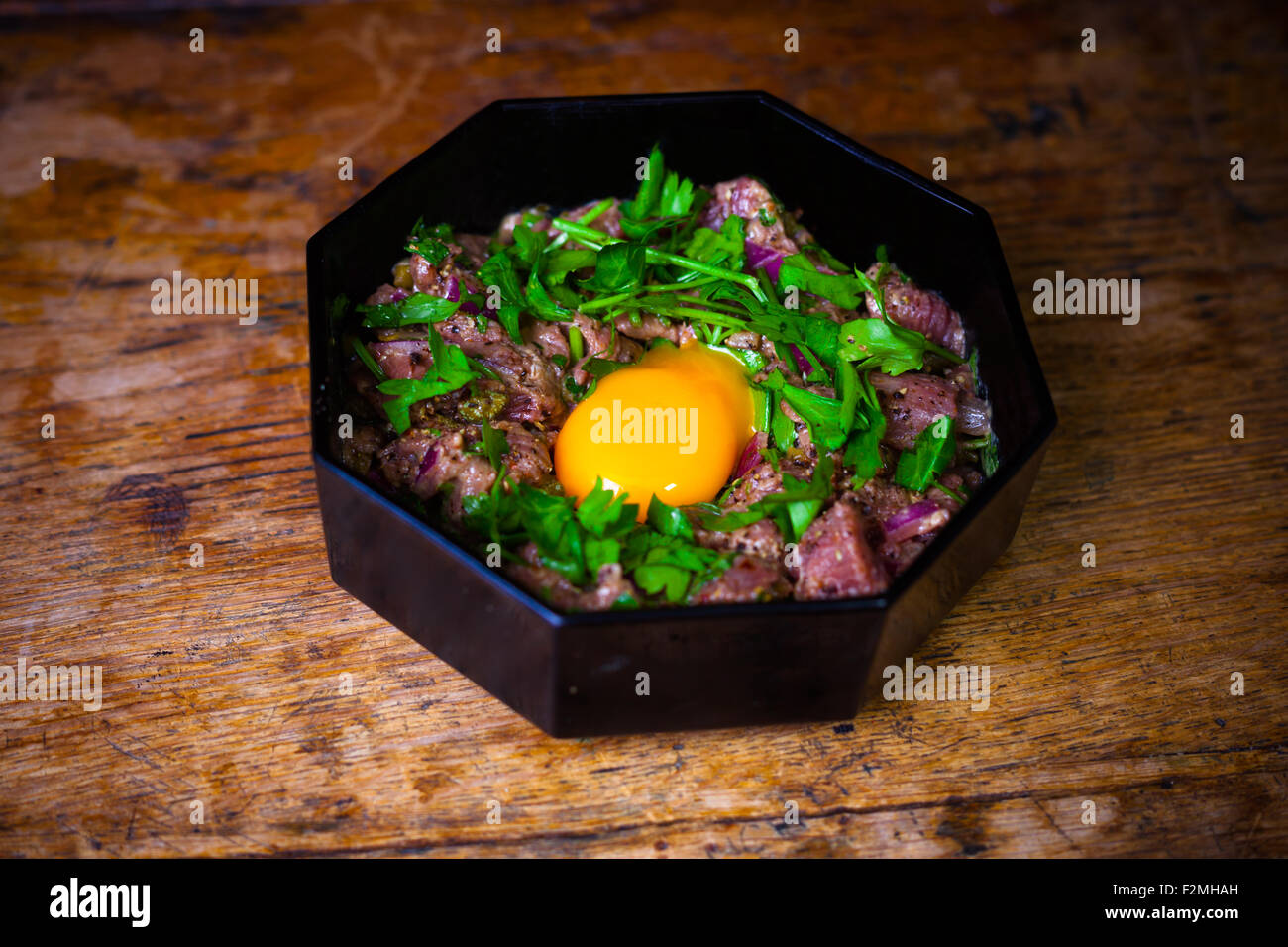 Steak tartare with a raw egg yolk Stock Photo Alamy