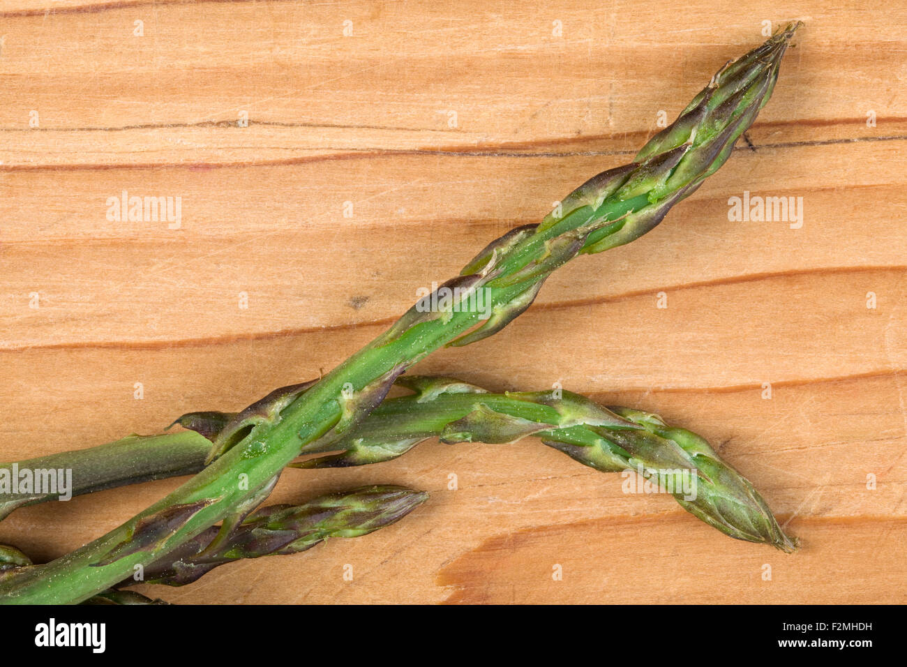Wild Asparagus on Wooden Table Stock Photo