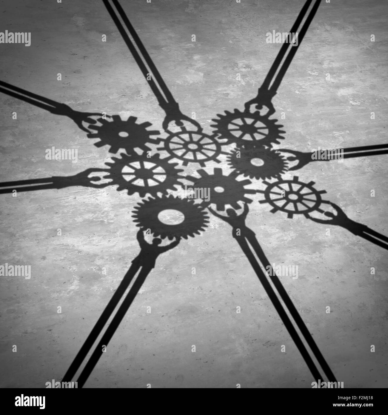 People teamwork holding gears connected together as a social community group symbol or business concept working for a common cause with cast shadows holding a cogwheel network in a corporate team partnership. Stock Photo