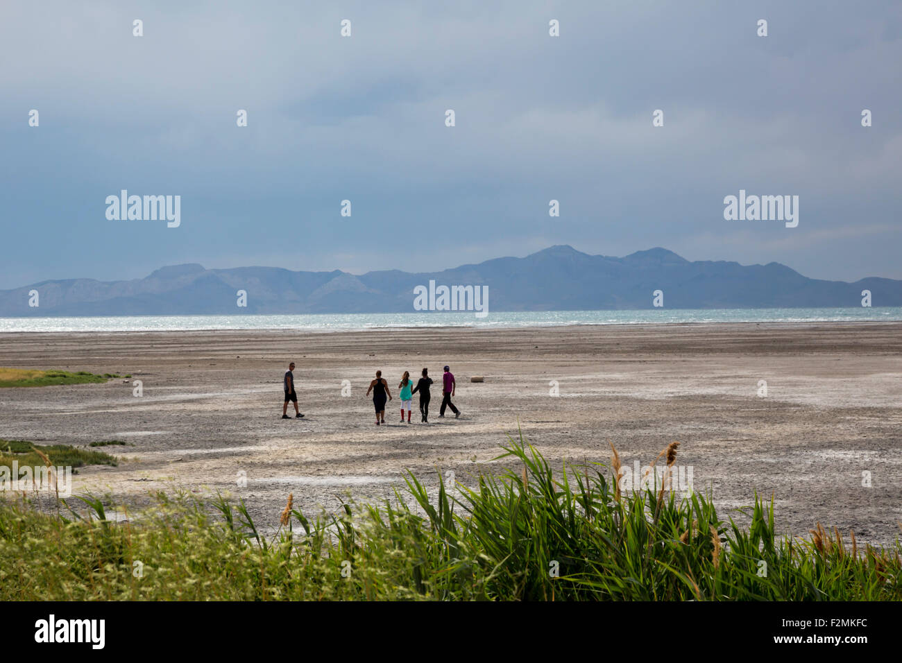 Salt Lake City, Utah People walking on salt flats at the edge of