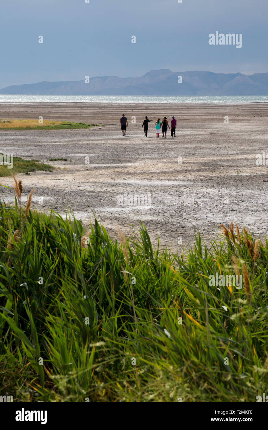 Salt Lake City, Utah People walking on salt flats at the edge of