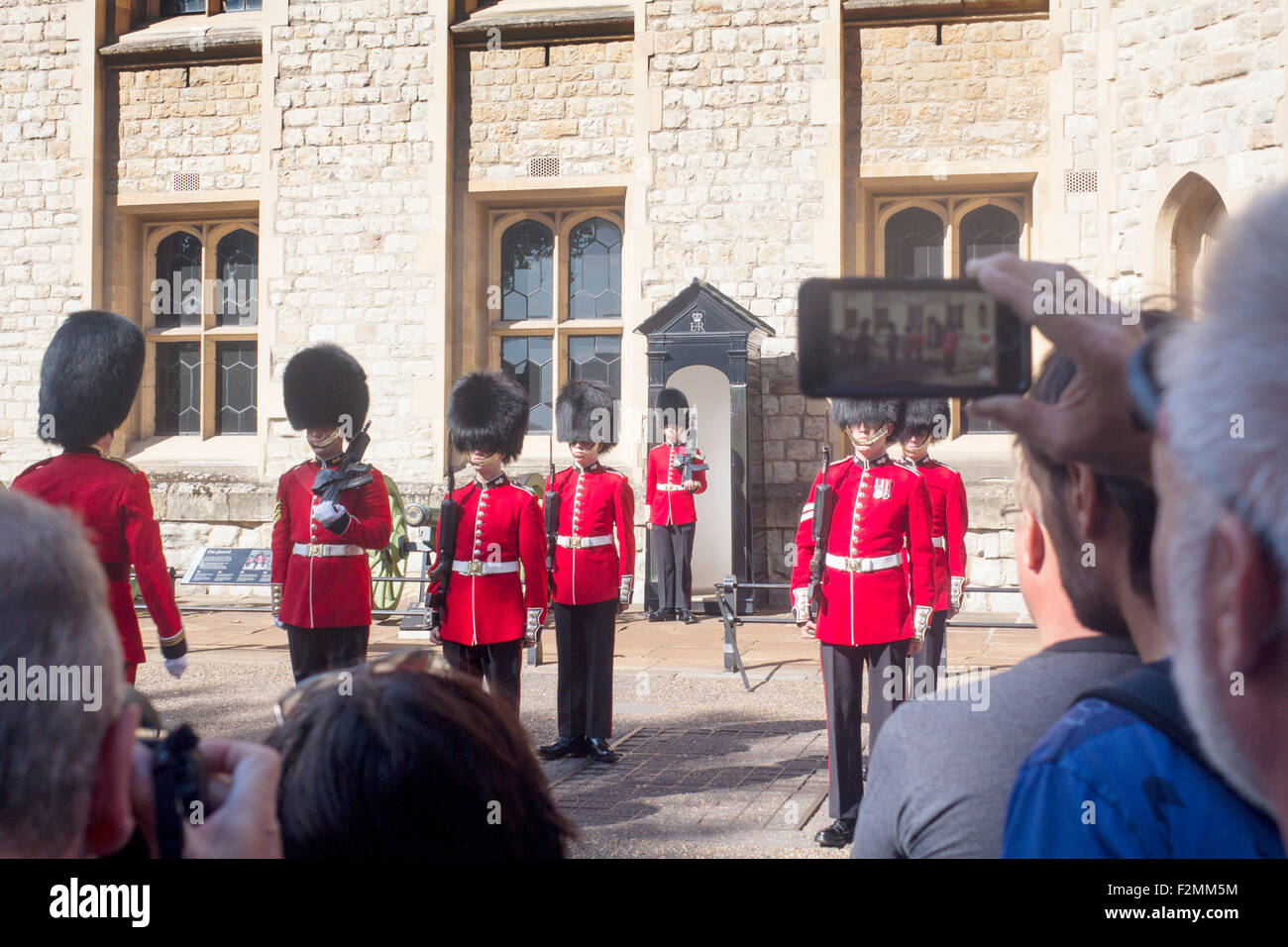 Ceremony of the Word with spectators tourists watching and filming Tower of London City of London England UK Stock Photo