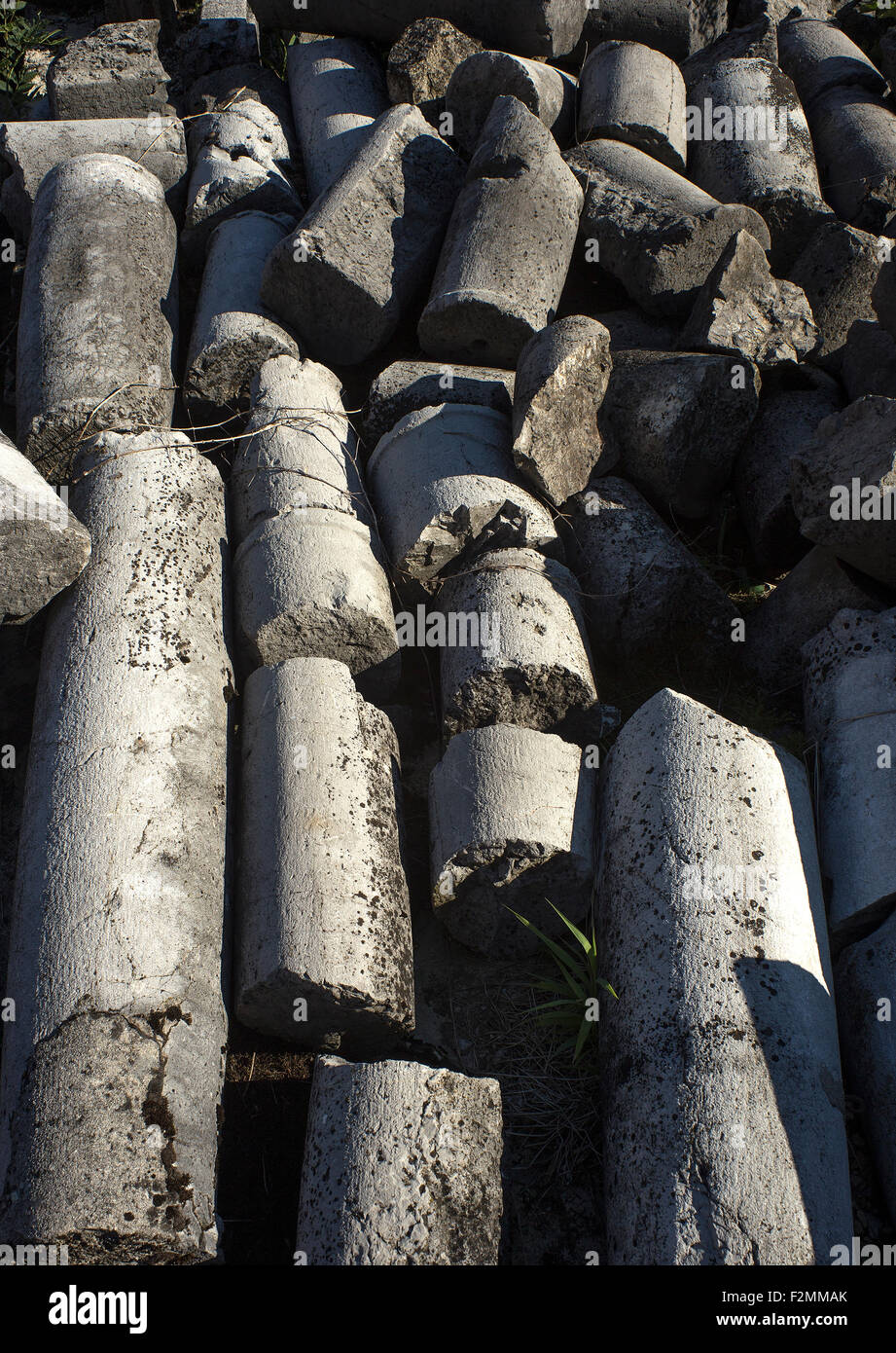 Old pillars laying on the ground, damaged Stock Photo Alamy