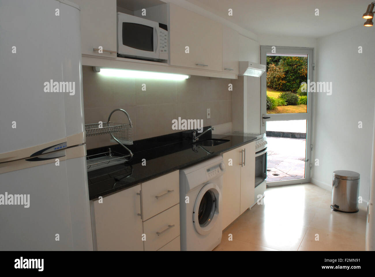 Modern kitchen with outdoor garden view contemporary style interior design. Stock Photo