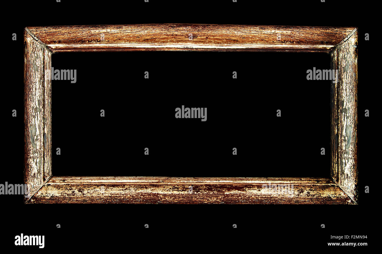Old wood picture frame isolated over empty black background. Includes clipping path, so you can easily cut and place on a design Stock Photo
