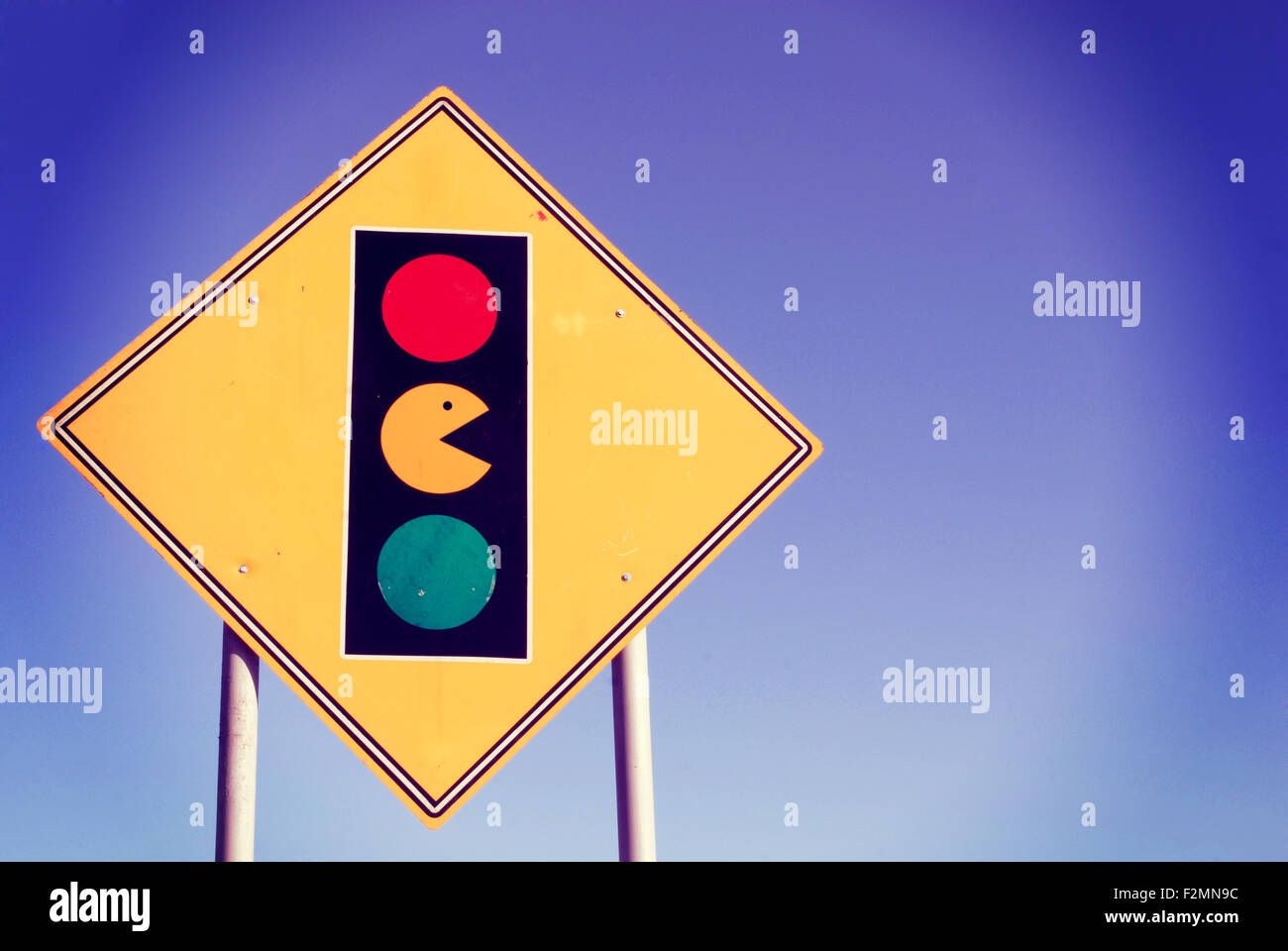 Game zone warning sign funny pacman and traffic light enjoy leisure activities. Ideal for poster, web, or online campaign. Stock Photo