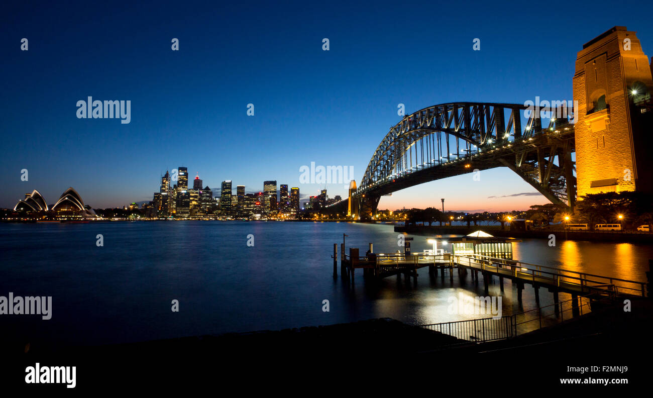 Sydney Harbour Bridge, city skyline and Opera House at night twilight dusk Sydney New South Wales NSW Australia Stock Photo