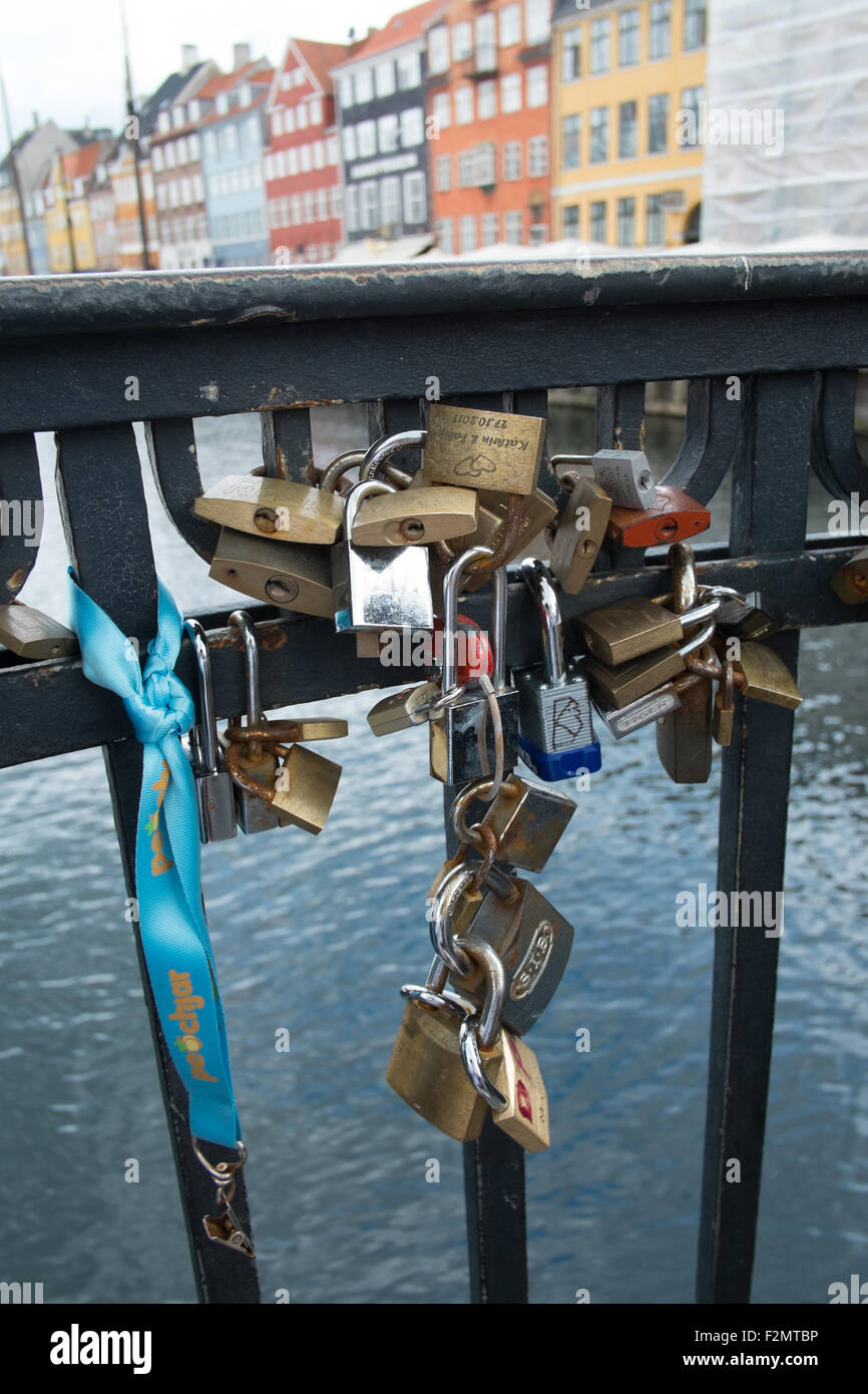 Love locks on the canal bridge at Nyhavn New Harbour Copenhagen Denmark