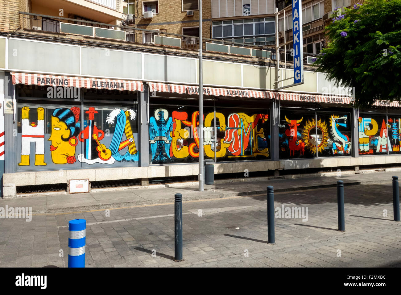 Andy Rios Muralist Mural of street artist ANDI RIVAS painting in Malaga Soho, art district ...