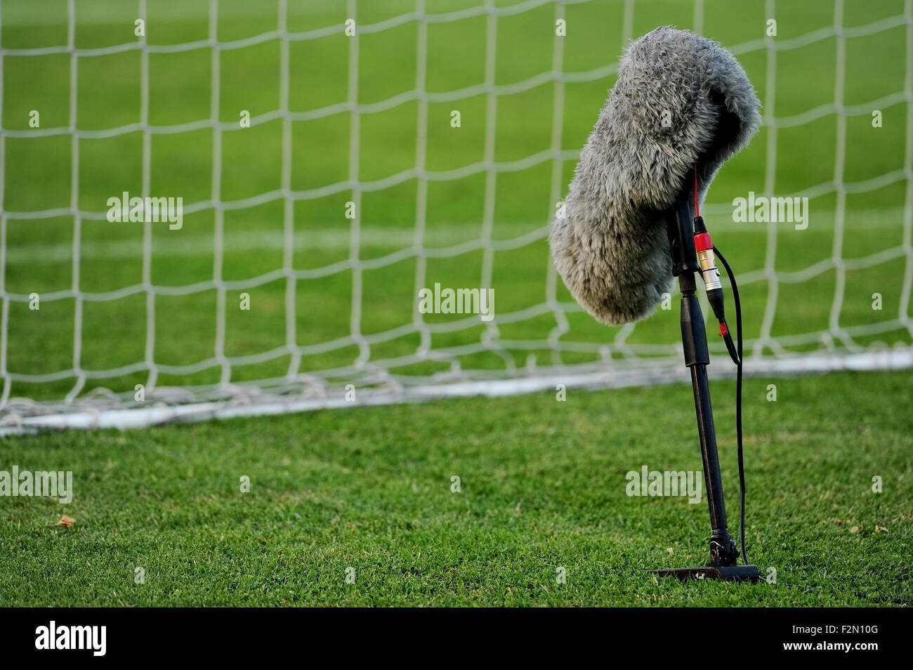 Professional sport microphone on a soccer field behind the net Stock Photo