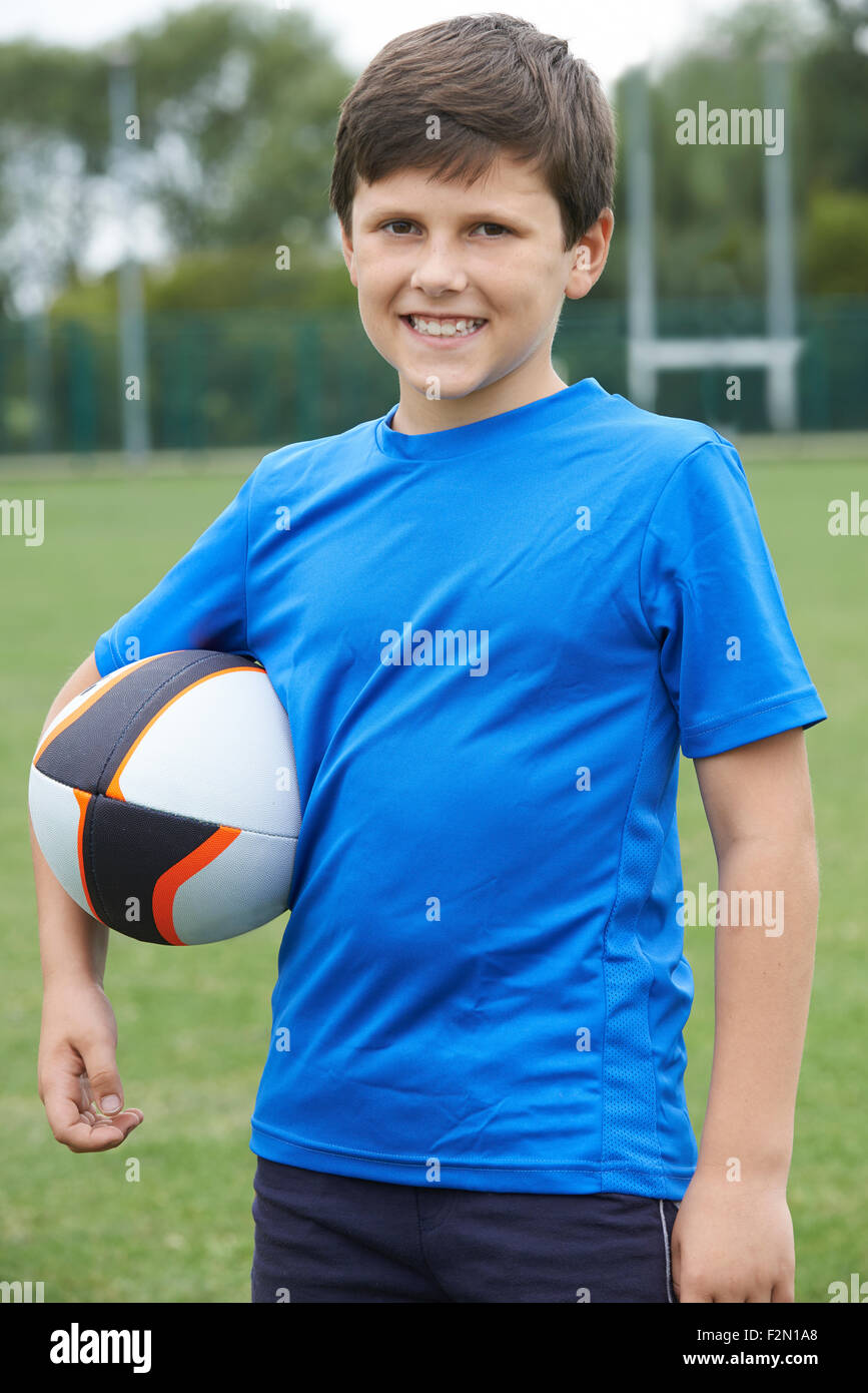 Boy holding rugby ball hires stock photography and images Alamy
