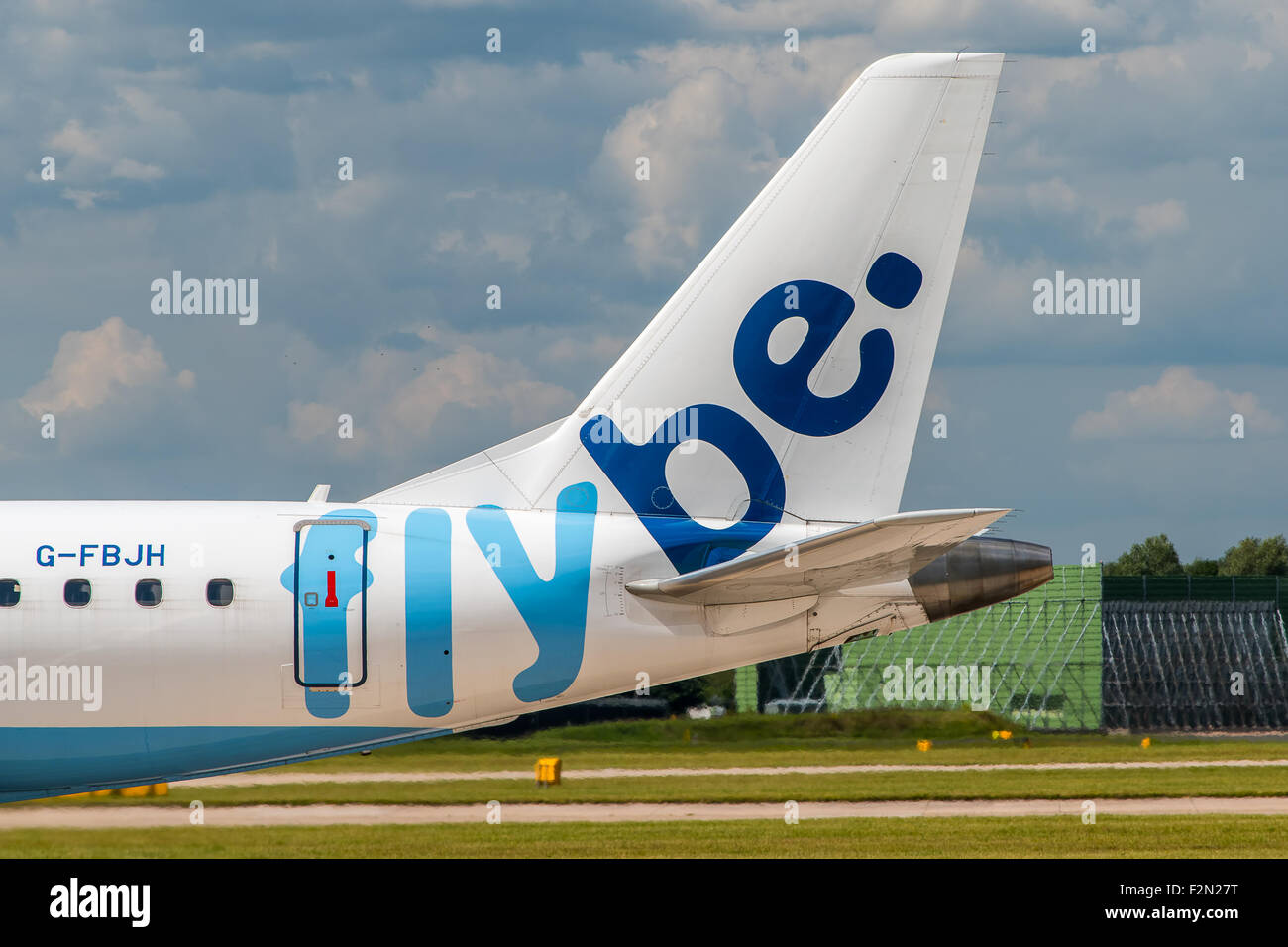 MANCHESTER, UNITED KINGDOM - AUG 07, 2015: Flybe Embraer ERJ-175 tail livery at Manchester Airport Aug 07 2015. Stock Photo