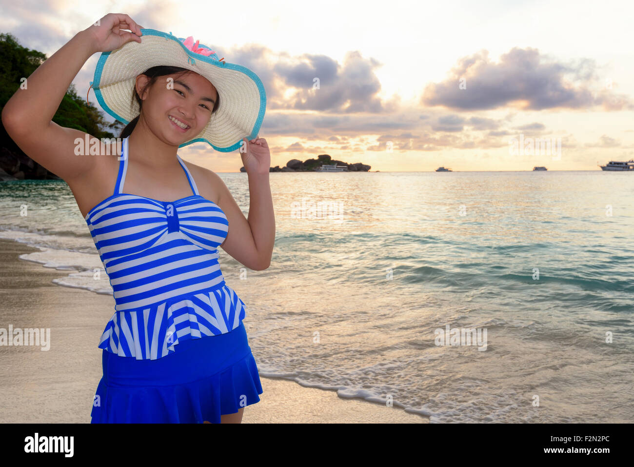 Woman In Swimsuit Standing Poses On Beach With Happy And Beautiful Sky Above The Sea During Sunrise At Honeymoon Bay Koh Miang Stock Photo Alamy