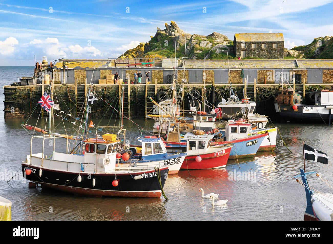 Fishing boats moored in Polperro harbour, Cornwall, UK Stock Photo