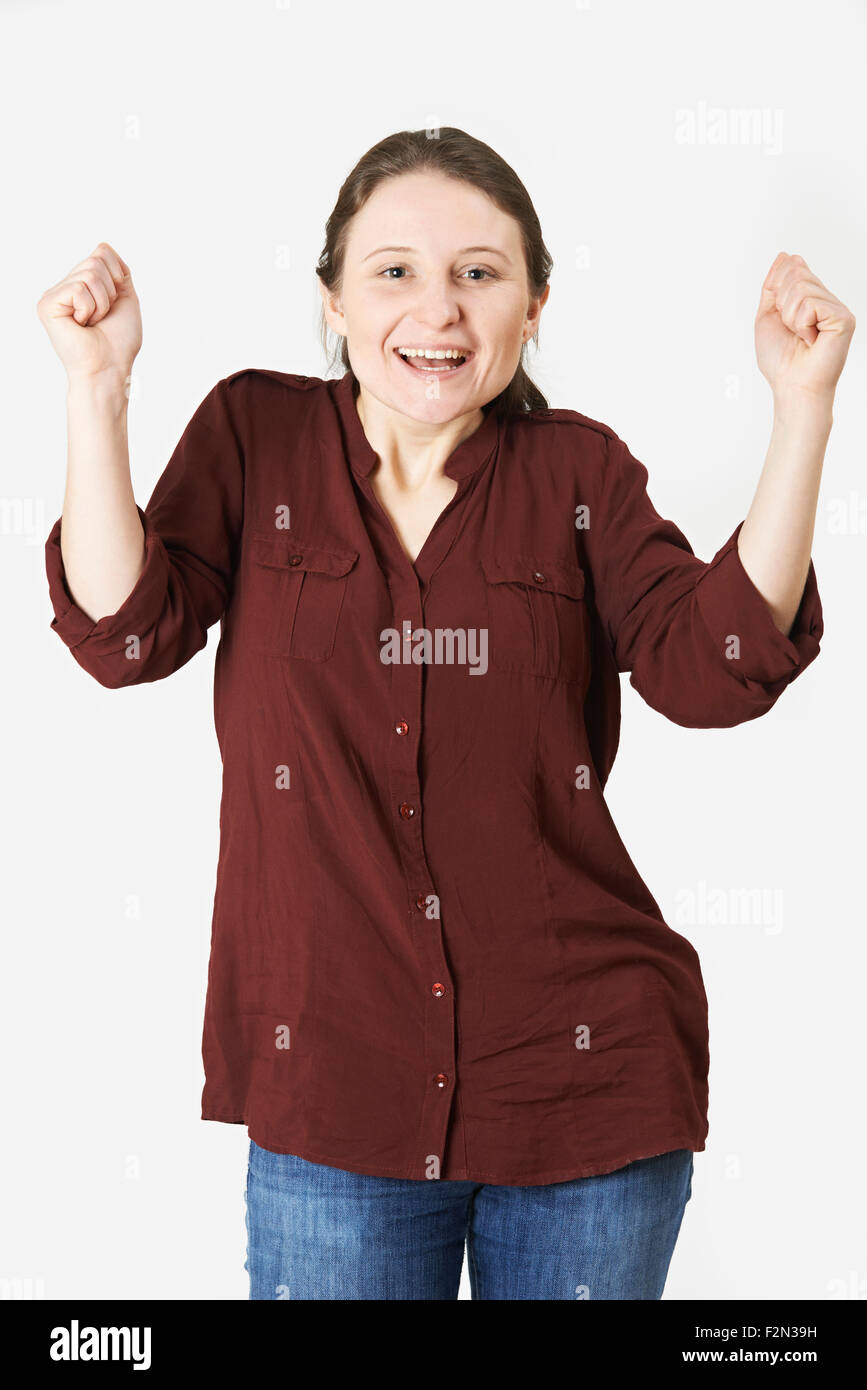 Studio Portrait Of Woman With Jubilant Expression Stock Photo