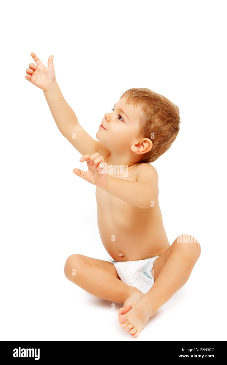 Baby boy in pampers pointing up, isolated on white Stock Photo - Alamy