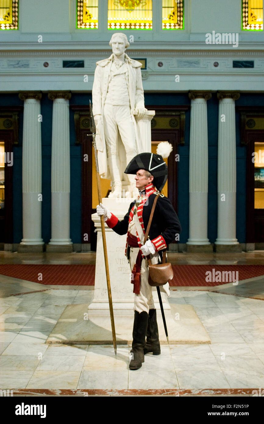 Costumed interpreter and a majestic marble sculpture of Thomas Jefferson in the lobby of the Jefferson Hotel, Richmond, VA Stock Photo