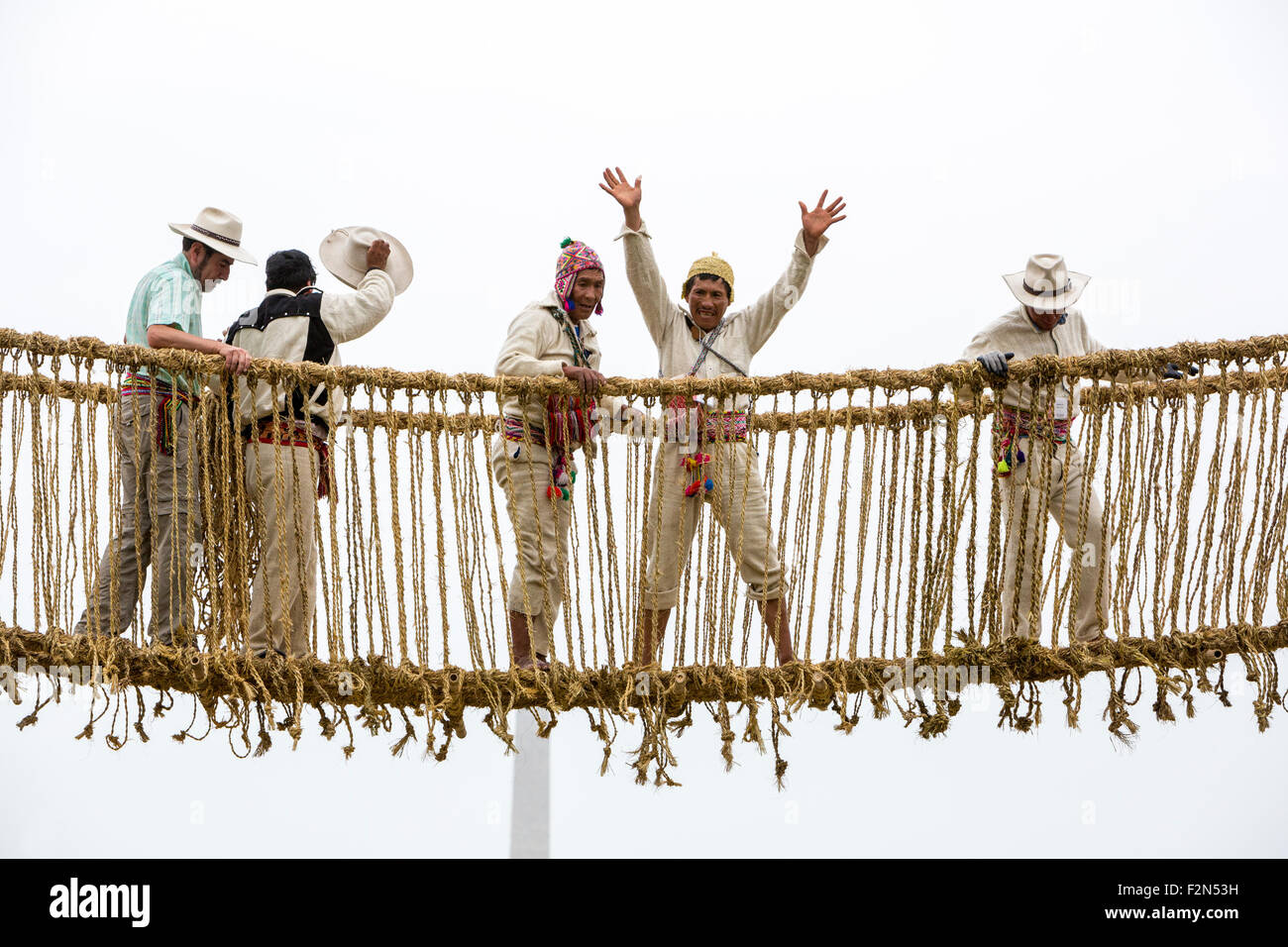 Quechua Men Celebrate Completion of the Q'eswachaka Bridge built across the Mall during July 2015 Peruvian Folk Life Festival. Stock Photo