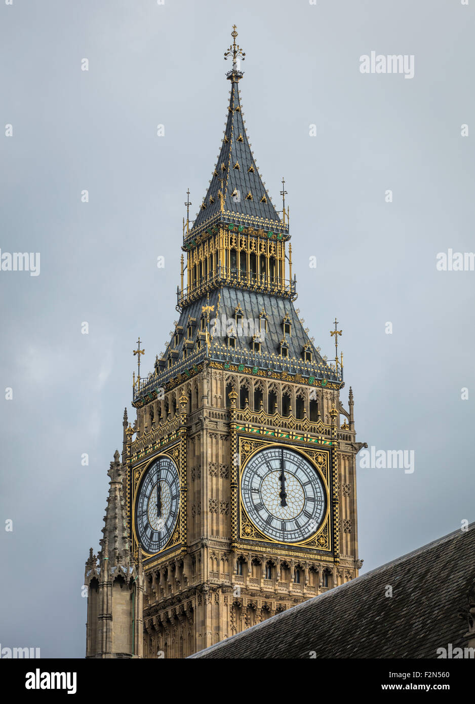Two Faces Of The Clock Tower Of Big Ben At Westminster Striking 12 Stock Photo Alamy