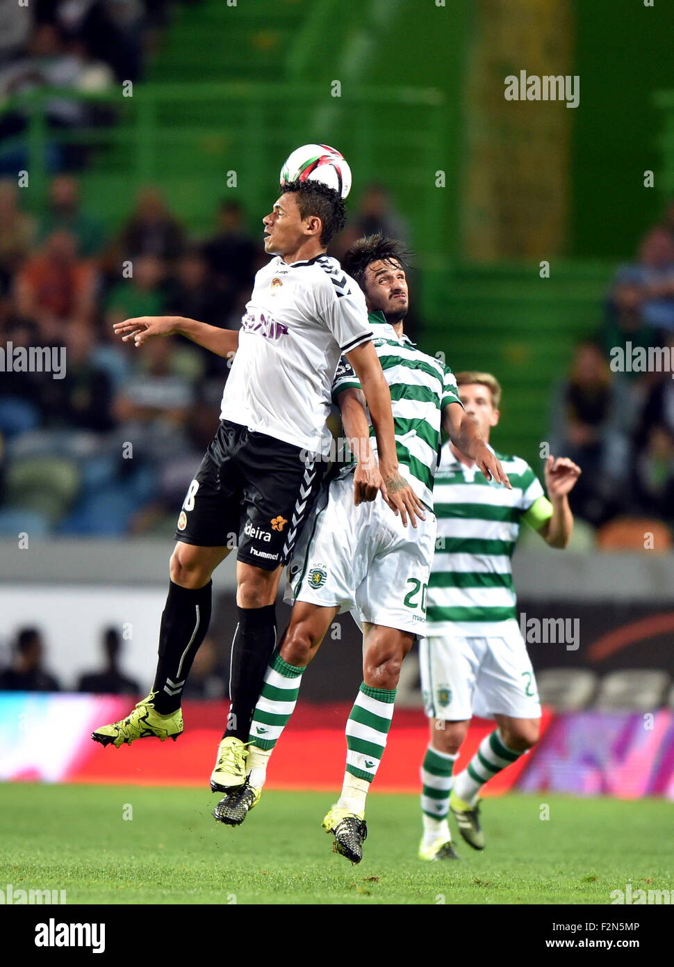 Lisbon, Portugal. 21st Sep, 2015. Sporting's Bryan Ruiz(C) vies with Nacional's player during the 5th round of Portuguese league soccer match at the Alvalade stadium in Lisbon, Portugal, on Sept. 21, 2015. Sporting won 1-0. © Zhang Liyun/Xinhua/Alamy Live News Stock Photo