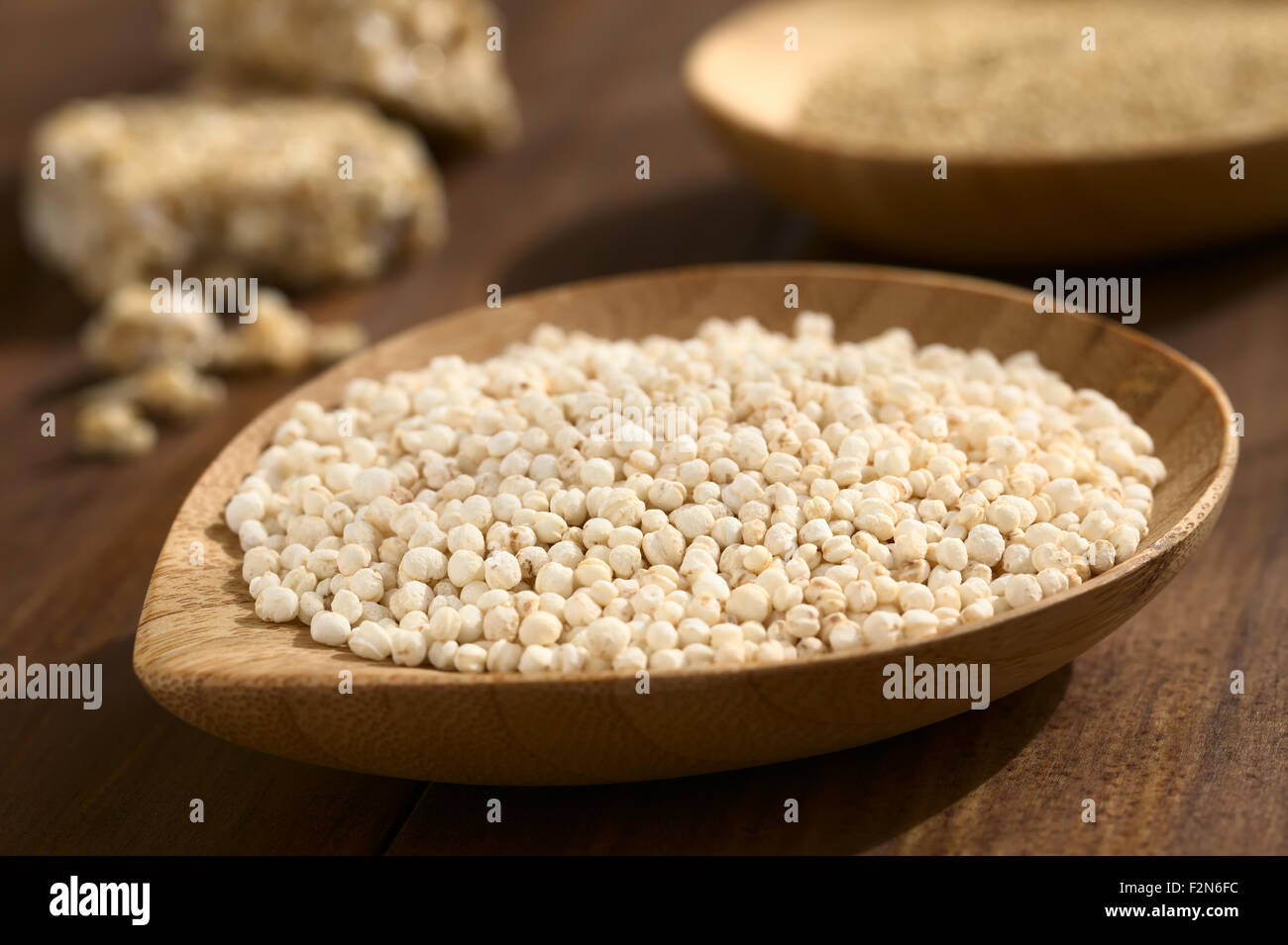 Popped white quinoa (lat. Chenopodium quinoa) cereal on small wooden