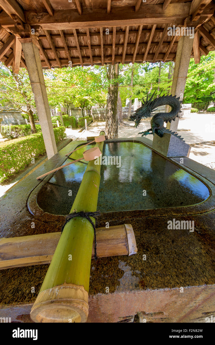 Japanese water basin with dragon Stock Photo - Alamy