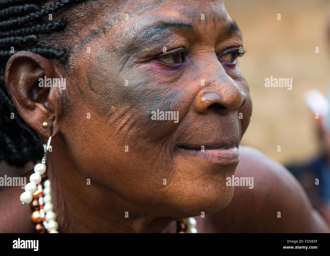Benin, West Africa, Bopa, voodoo priestess with tattooed face during a ceremony Stock Photo