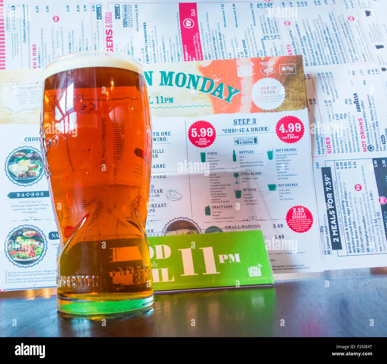 Pint of beer and food served until 11pm menu in J D Wetherspoon pub, England, UK Stock Photo