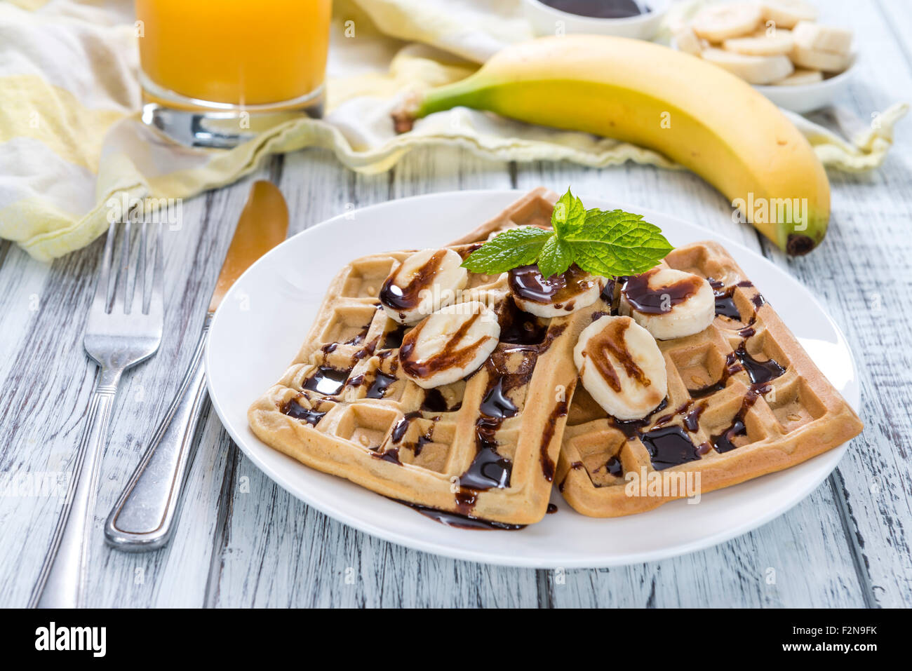Sweet Breakfast (Waffles with Bananas and creamy Chocolate Sauce Stock ...