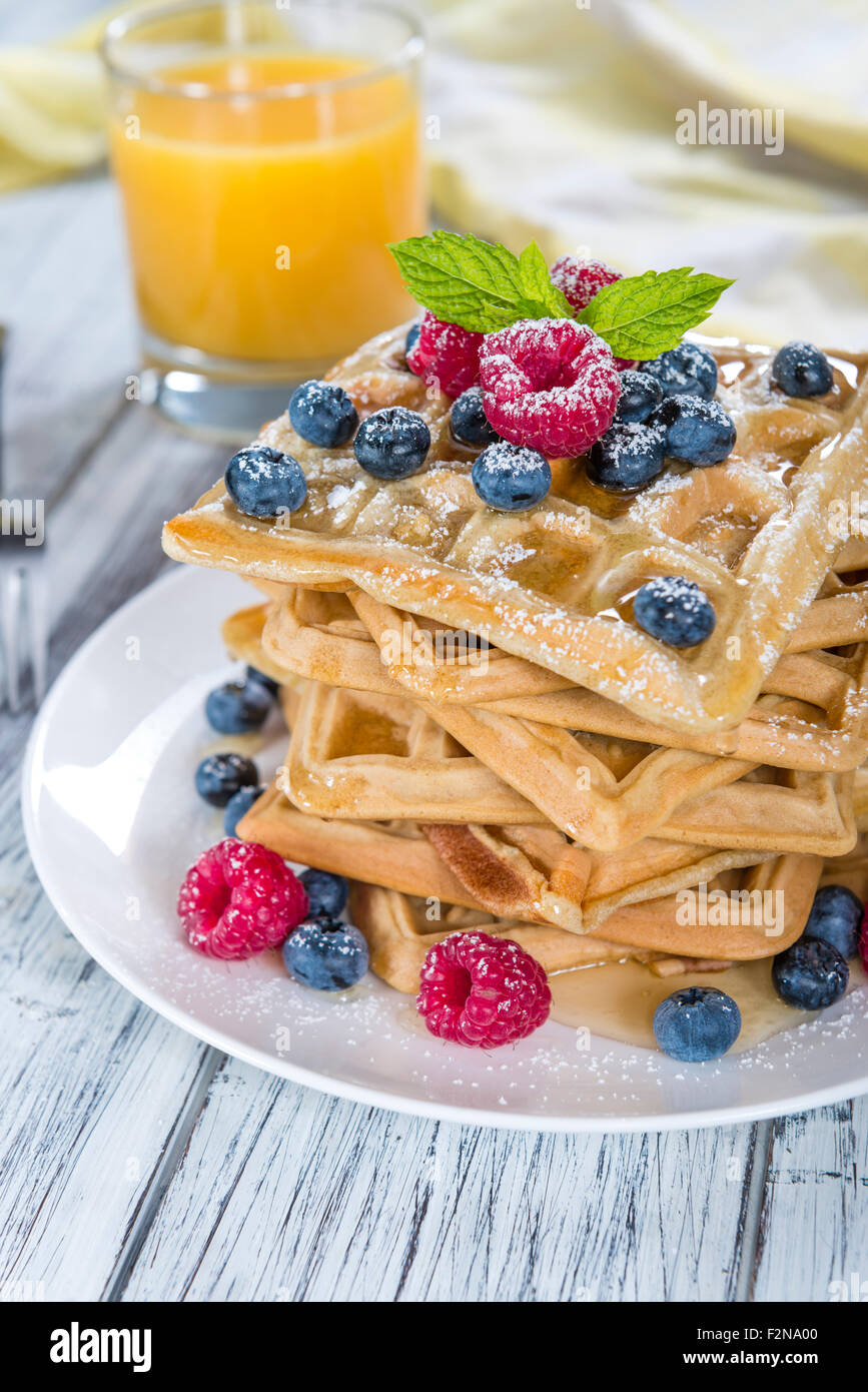 Homemade Waffles with mixed Berries and powder sugar (close-up shot) Stock Photo