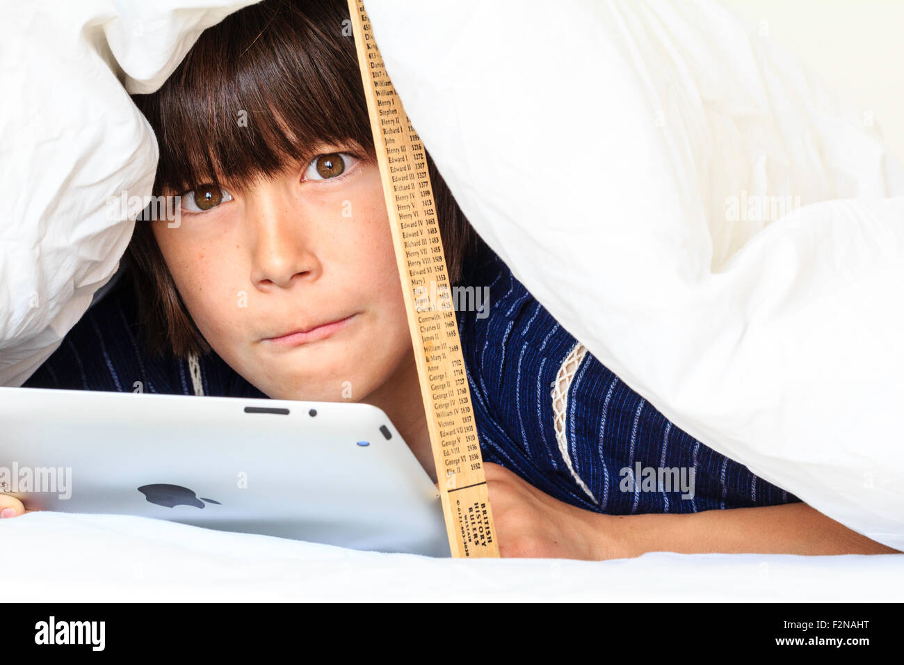 Caucasian Child Boy 10 11 Year Old Half Hiding Under White Duvet Propped Up By A Ruler Head And Shoulders Of Boy As He Uses Ipad Pensive Look Stock Photo Alamy Caucasian Child Boy 10 11 Year Old Half Hiding Under White Duvet Propped Up By A Ruler Head And Shoulders Of Boy As He Uses Ipad Pensive Look Stock Photo Alamy