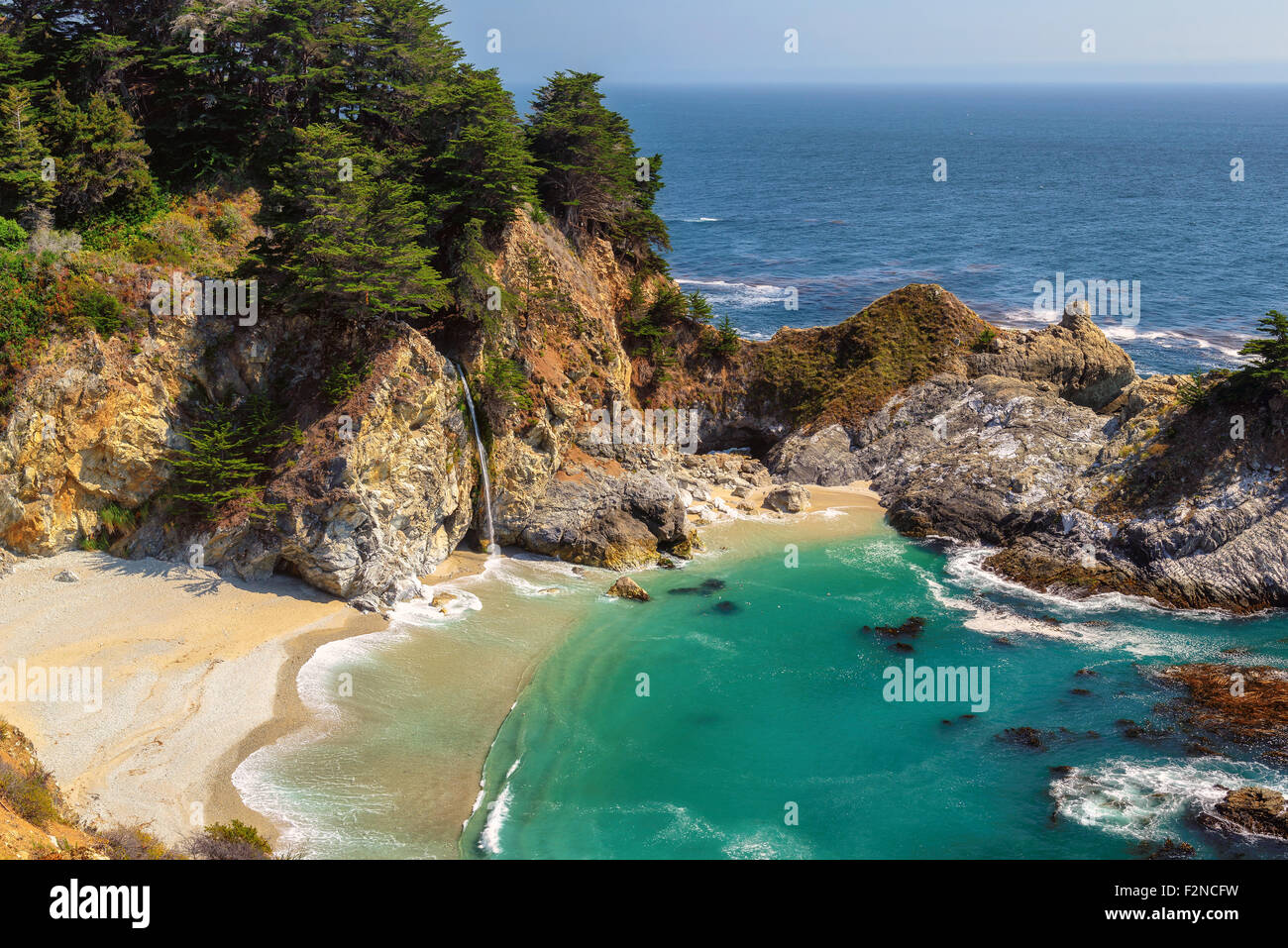 Fine beach and falls in Pacific coast, Big Sur. California, USA Stock Photo