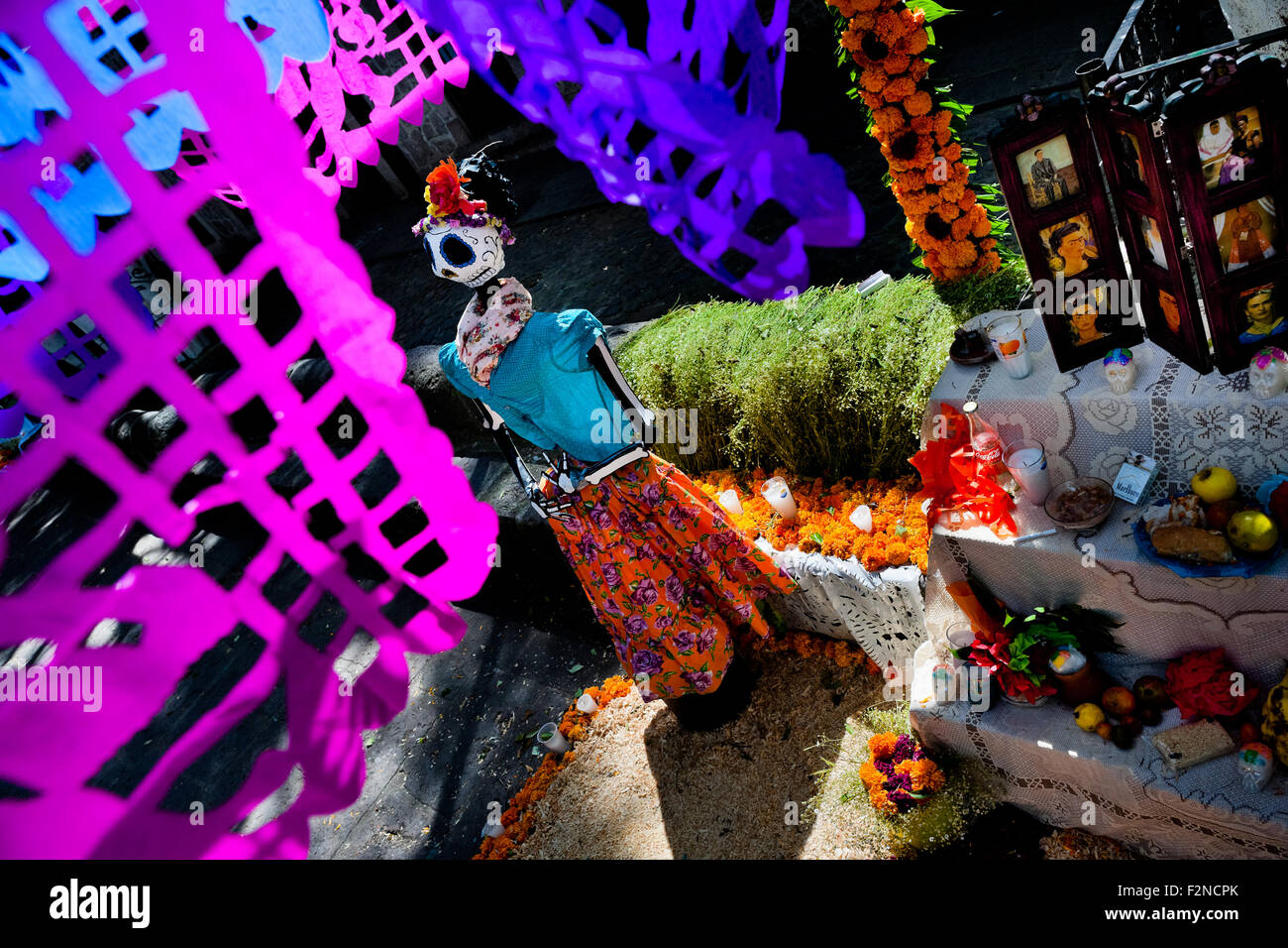 Chiseled paper flags are hung over the altar of the dead during the Day of the Dead celebration in Morelia, Mexico. Stock Photo
