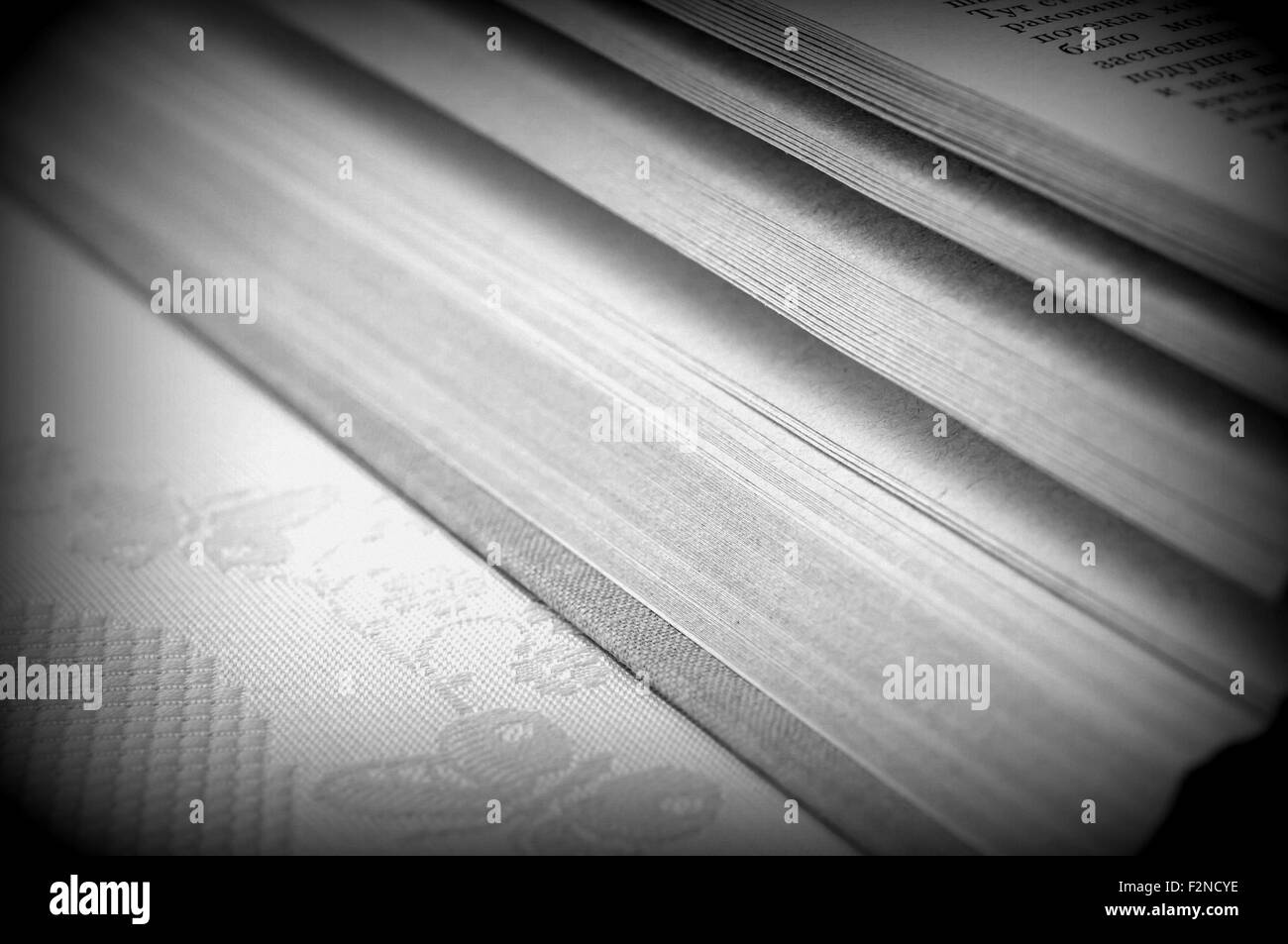 An old book lying on the table close up Stock Photo
