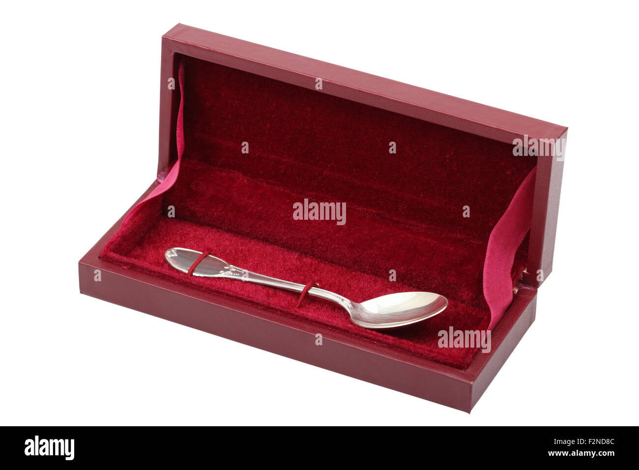 Silver spoon in box. Isolated with clipping path. Stock Photo