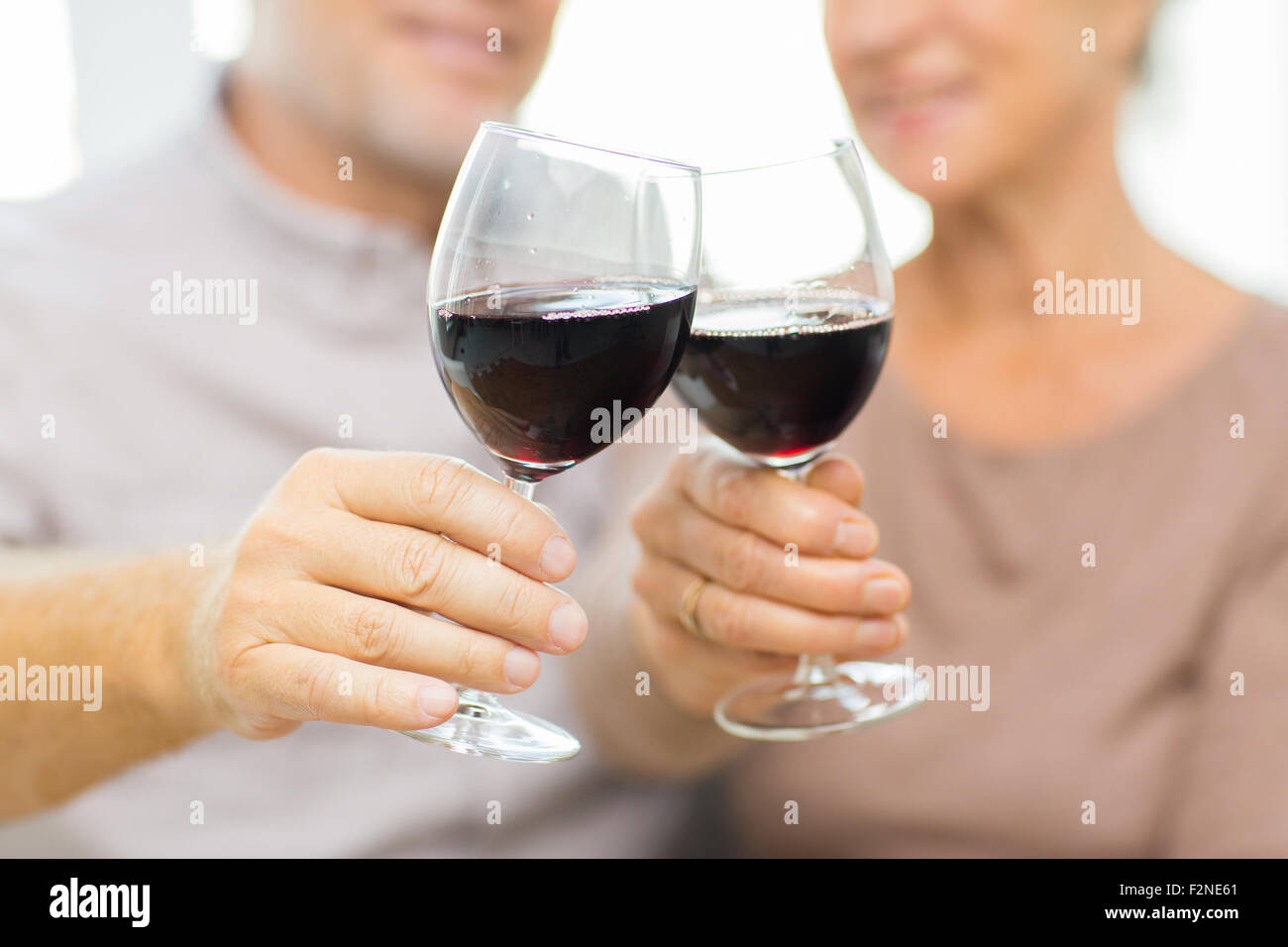 close up of happy senior couple with red wine Stock Photo