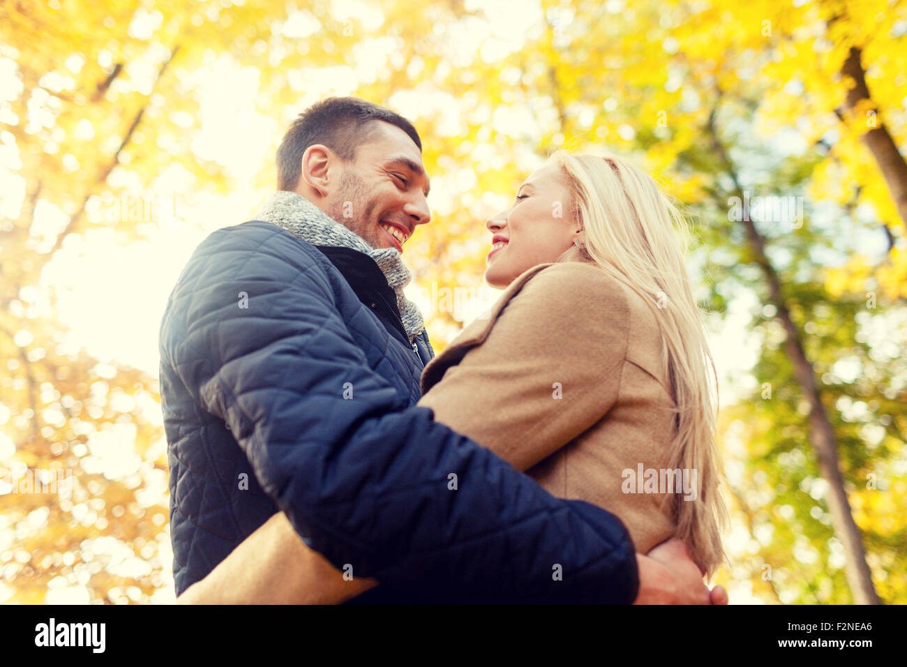 smiling couple hugging in autumn park Stock Photo - Alamy