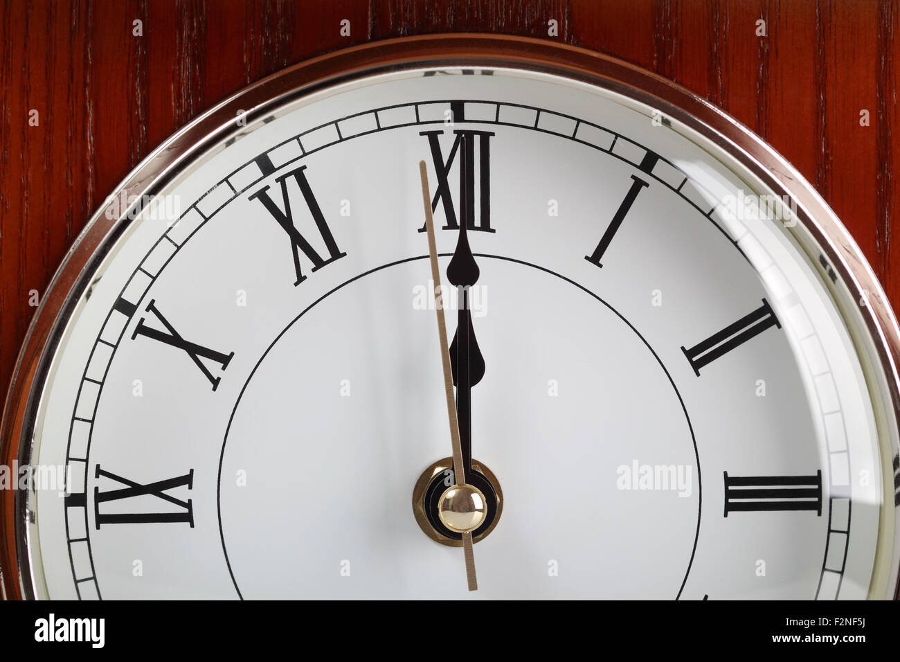 Twelve o'clock. Last second. Wooden table clock Stock Photo Alamy