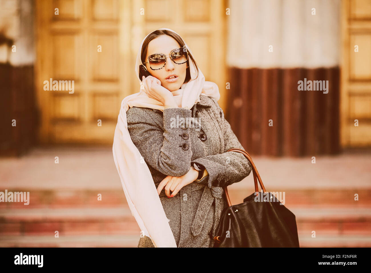 girl in a coat on the street Stock Photo - Alamy
