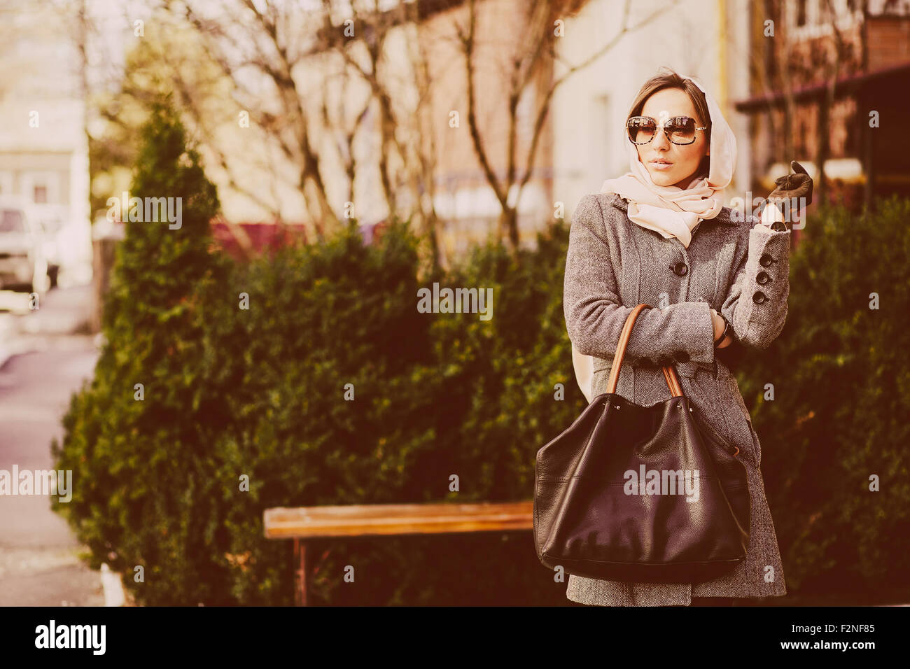 Happy young beautiful girl posing in the park Stock Photo - Alamy