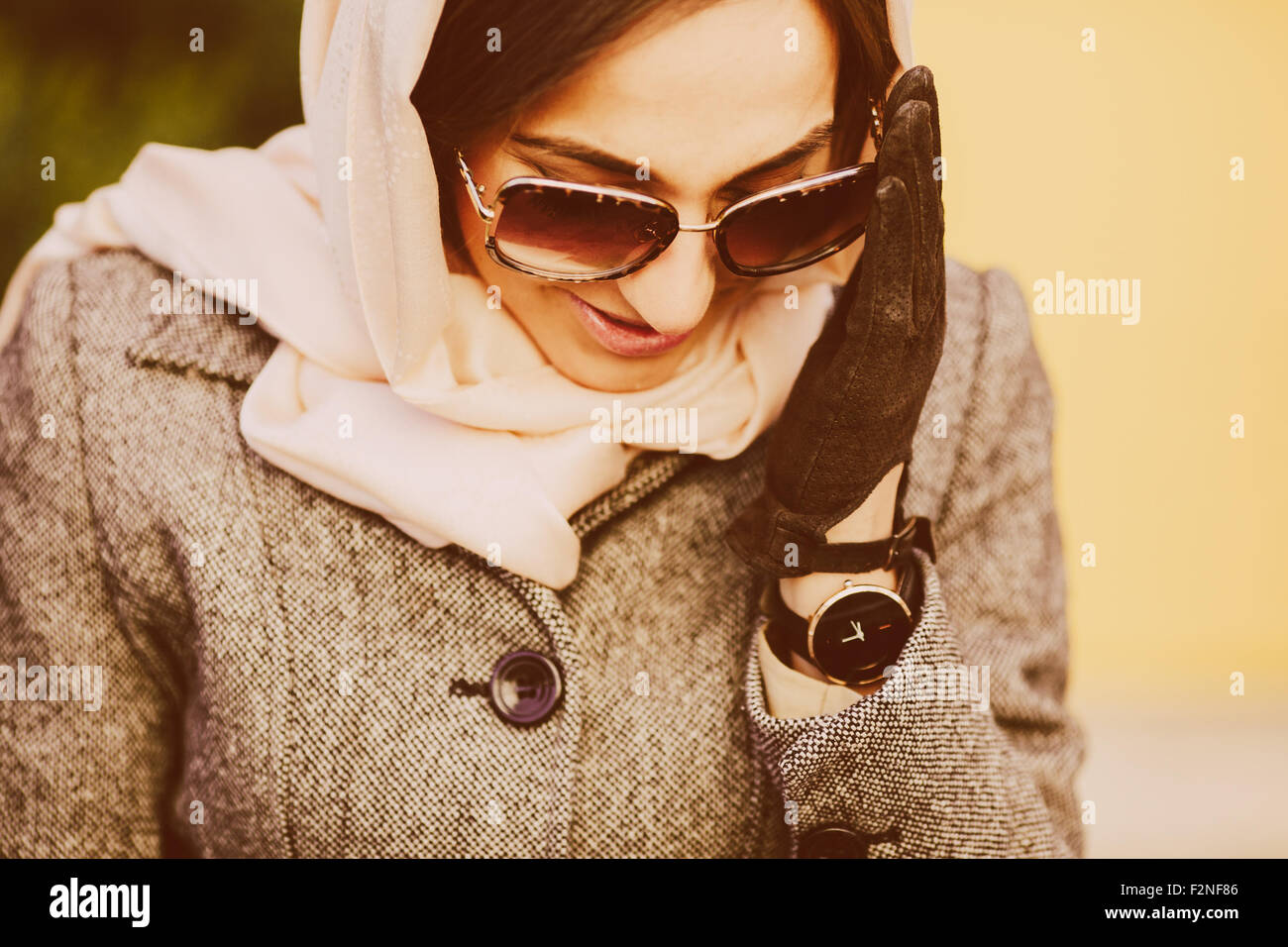 beautiful girl sitting on a bench in the park Stock Photo - Alamy