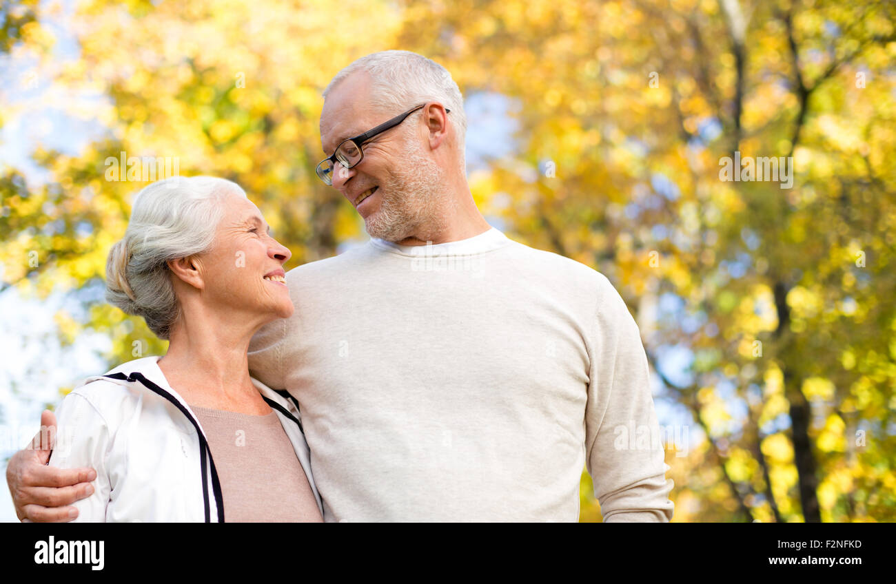 happy senior couple in autumn park Stock Photo - Alamy
