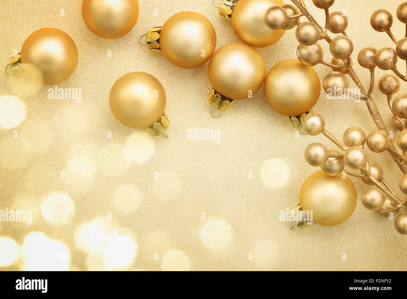 Golden Christmas balls on glitter background Stock Photo
